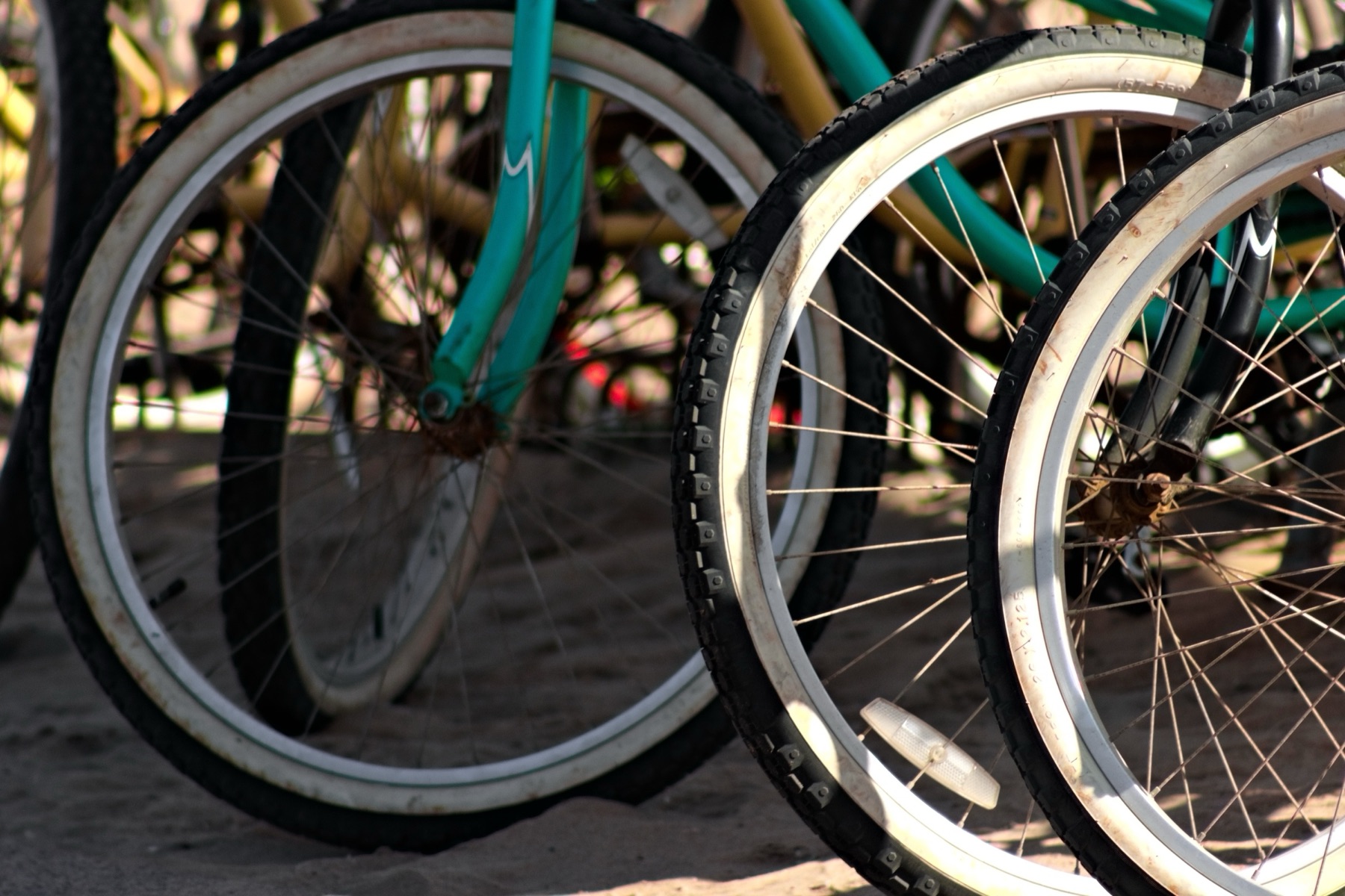 A beach cruiser bicycle propped up, seen close in