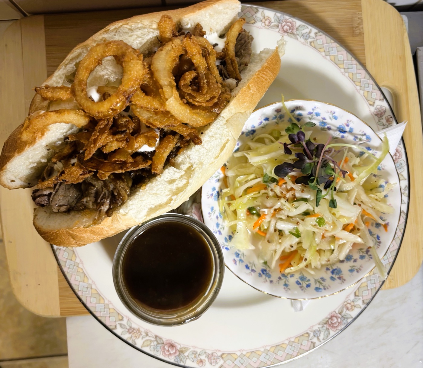 The Philly roasted pork dip with onion rings